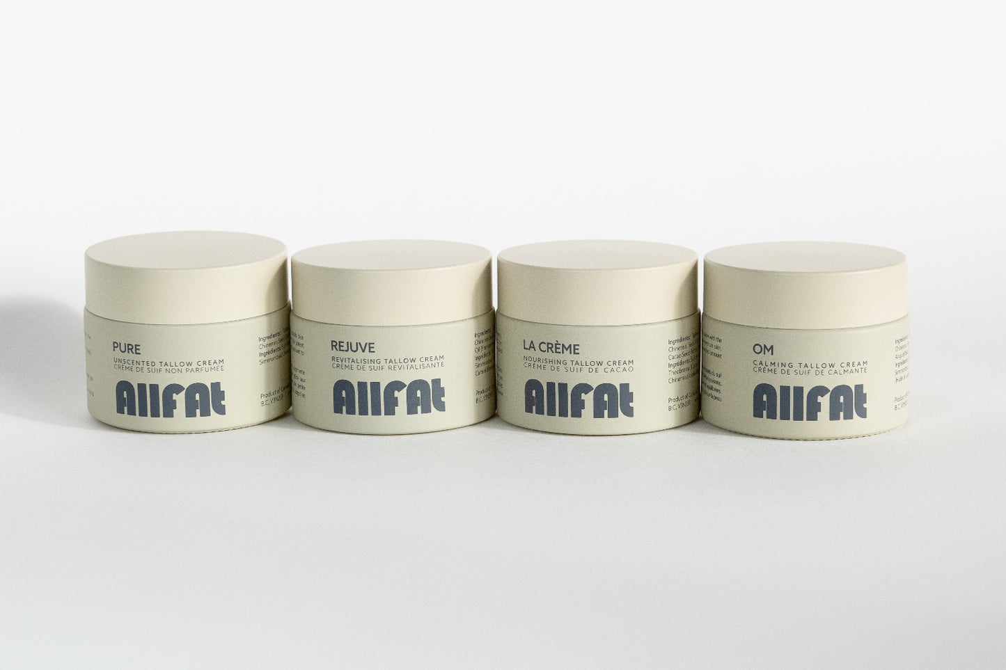 Four jars of AIIFAT tallow cream for face on a white background