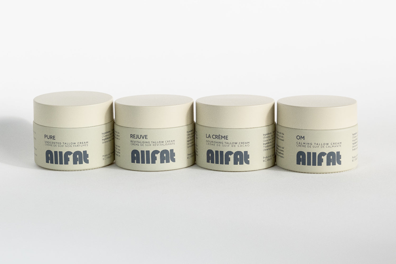 Four jars of AIIFAT tallow cream for face on a white background