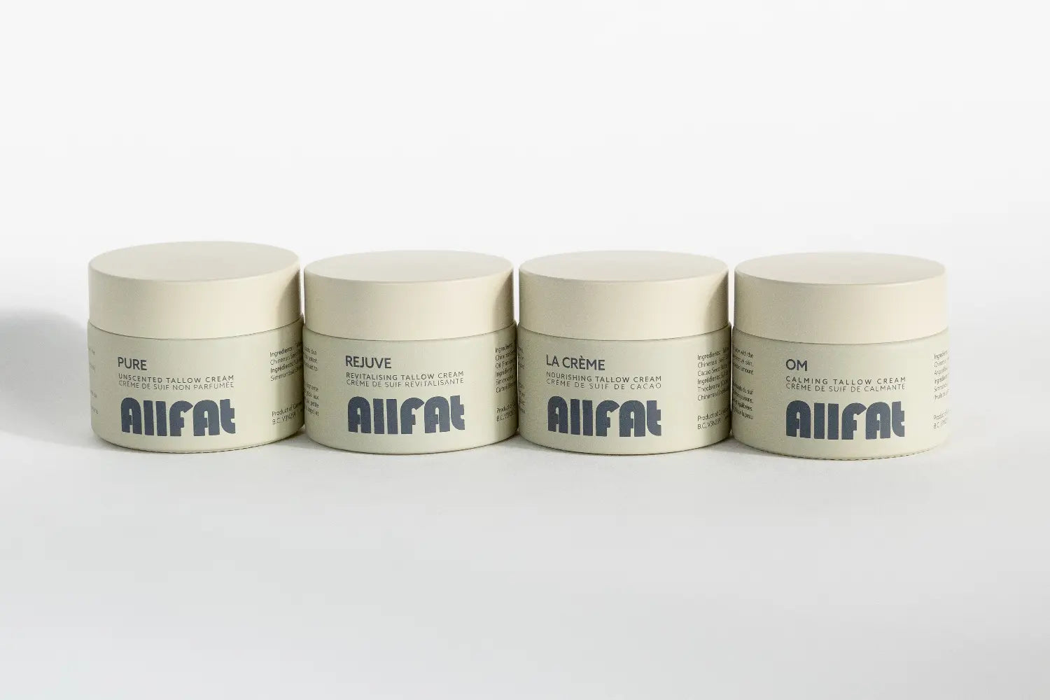 Four jars of AIIFAT tallow cream on a white background