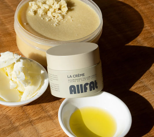 Jars of 'La Crème' allfat tallow cream on a wooden surface