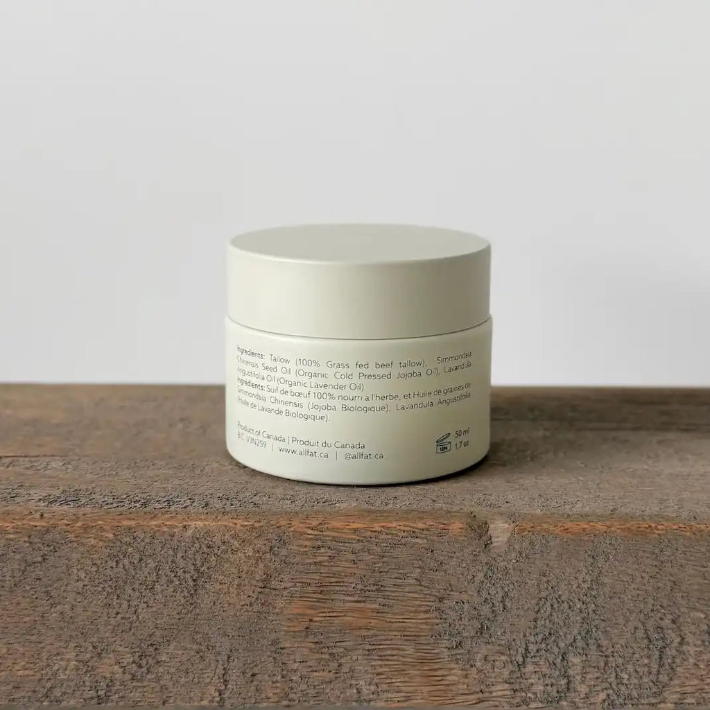 Cream jar on a wooden surface with a neutral background