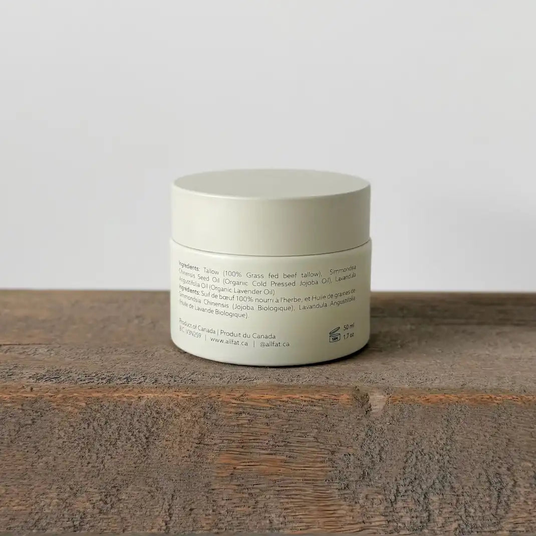 Cream jar on a wooden surface with a neutral background