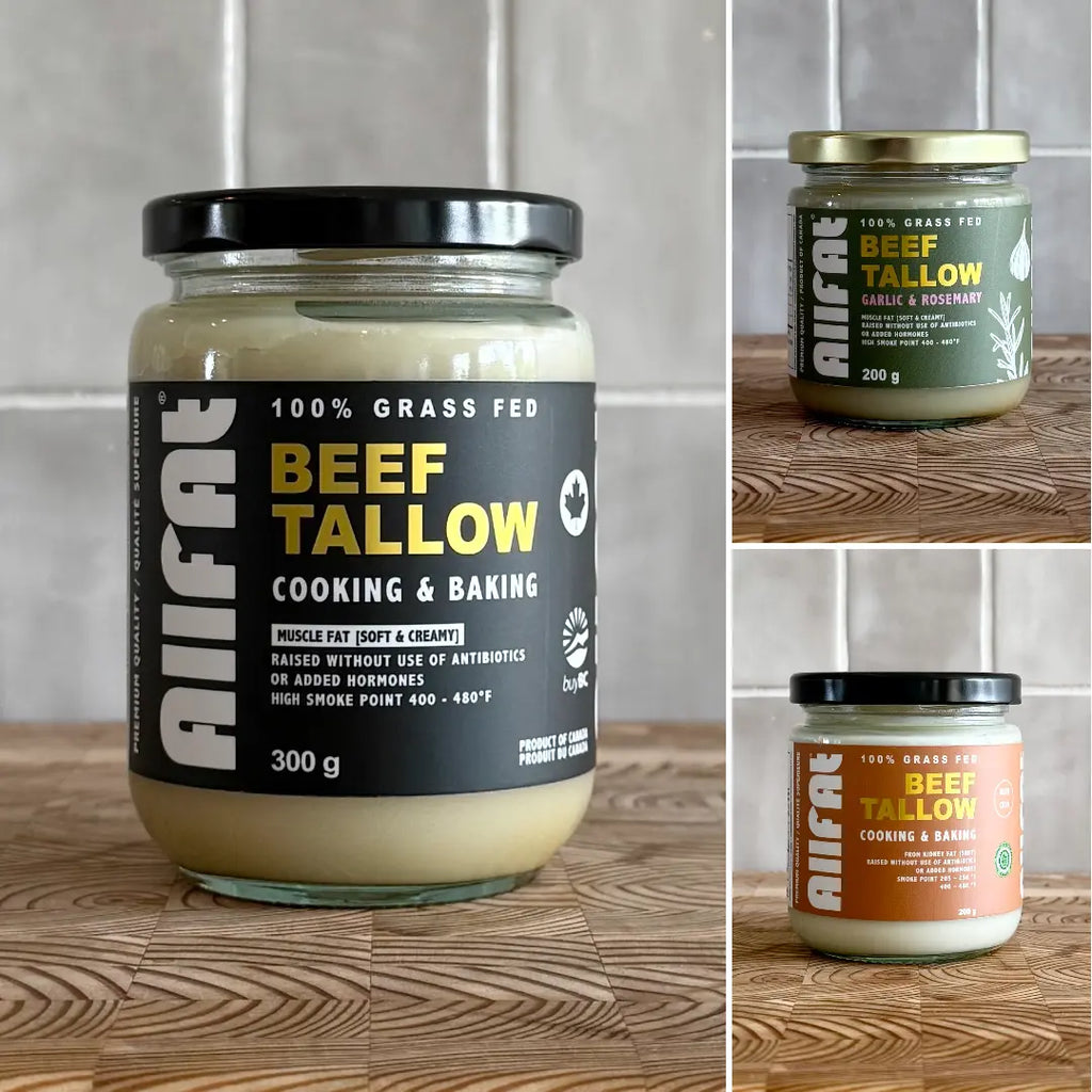 Jars of beef tallow with different labels on a wooden surface and tiled wall background.